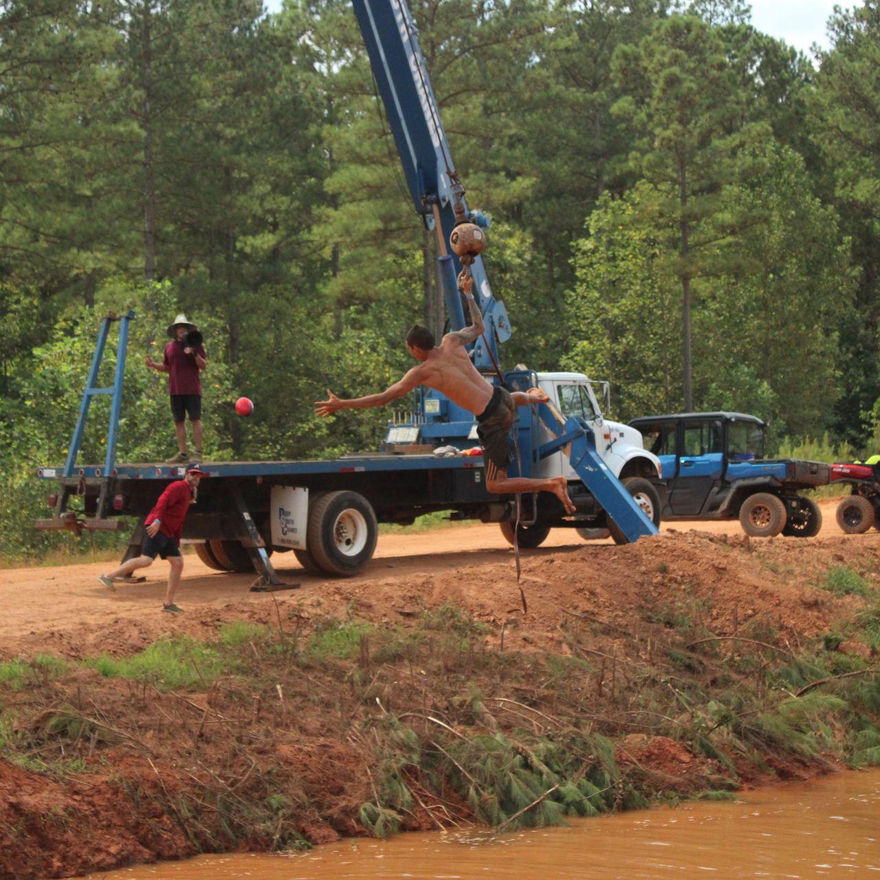 Rider leaping off the crane swing into the pond at a Freedom Fest event.